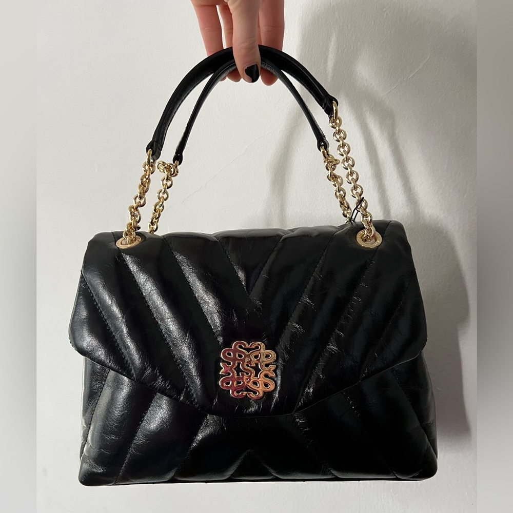 Black Sandro Handbag (NEW with tags). Gold straps, suede interior, REAL leather.